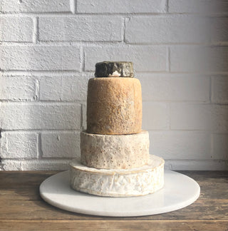 sholebroke cheese wedding cake with eve on the top